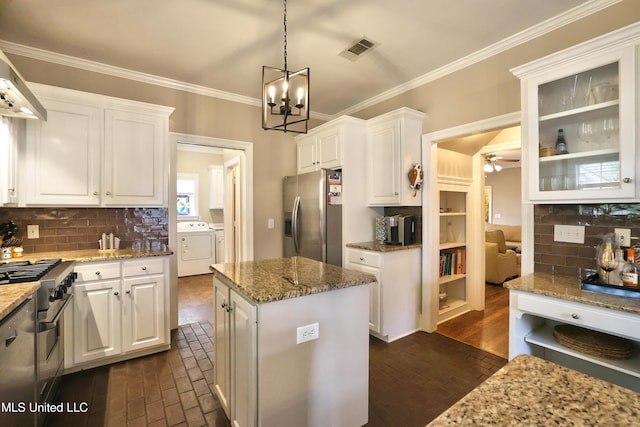 kitchen featuring washer and clothes dryer, visible vents, white cabinets, and appliances with stainless steel finishes