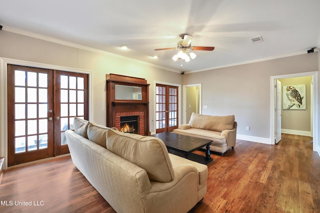 living room with baseboards, ceiling fan, french doors, a fireplace, and dark wood-style flooring