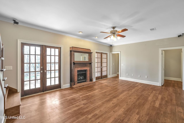 unfurnished living room with visible vents, baseboards, french doors, wood finished floors, and a ceiling fan