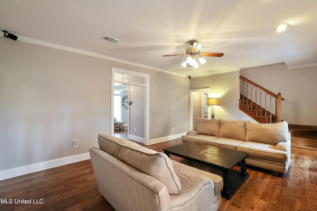 living room featuring visible vents, stairway, baseboards, and wood finished floors