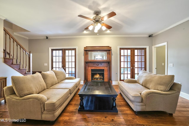 living room featuring french doors, a healthy amount of sunlight, and wood finished floors