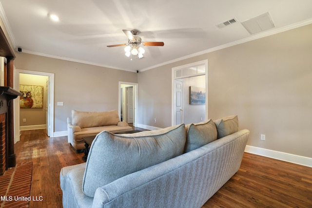 living area featuring visible vents, baseboards, ceiling fan, and wood finished floors