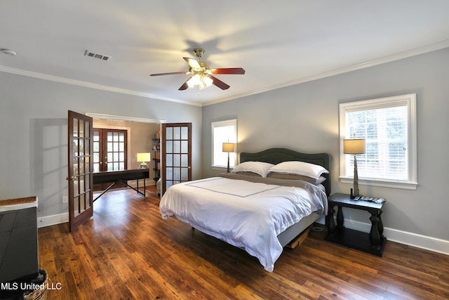 bedroom featuring wood finished floors, visible vents, baseboards, french doors, and crown molding