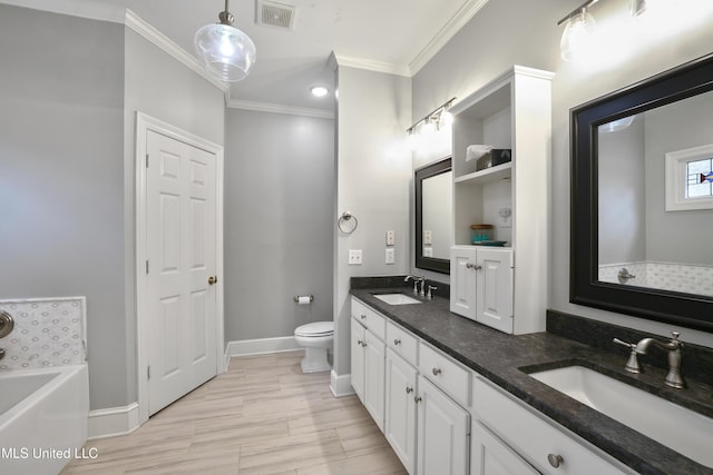 bathroom with a bath, visible vents, crown molding, and a sink