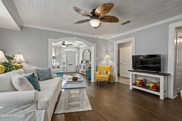 living room with wood ceiling, dark wood-type flooring, crown molding, and ceiling fan