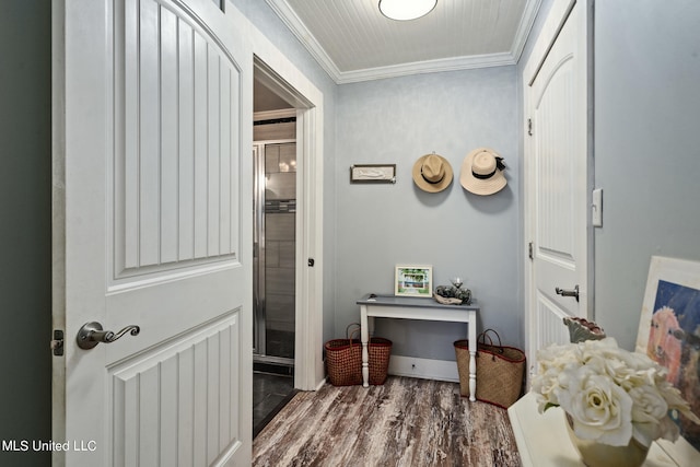 interior space with ornamental molding and hardwood / wood-style floors