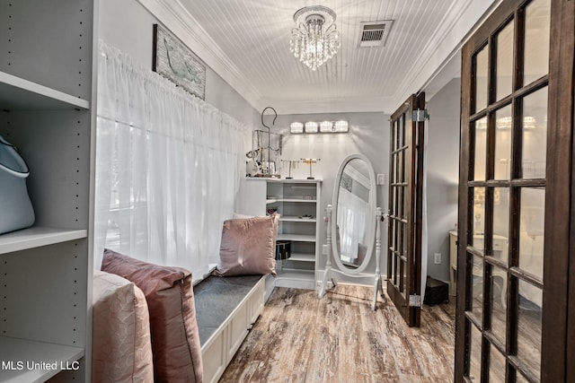 813 42nd Ave, Gulfport, MS 39501 - entryway with a chandelier, crown molding, and wood finished floors