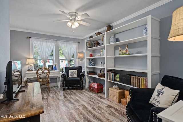 sitting room featuring crown molding, hardwood / wood-style floors, and ceiling fan