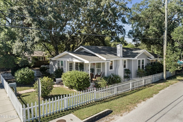 813 42nd Ave, Gulfport, MS 39501 - ranch-style house featuring a chimney, roof with shingles, and a porch