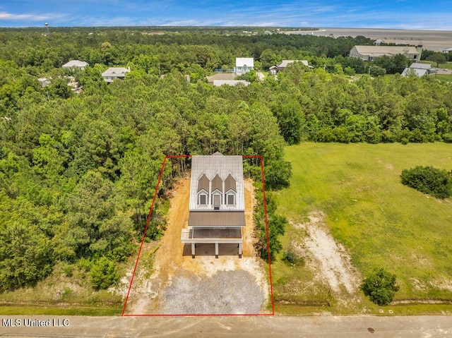 200 Farrar Ln, Waveland, MS 39576 - aerial view of property and surrounding area featuring a forest and property parcel outlined