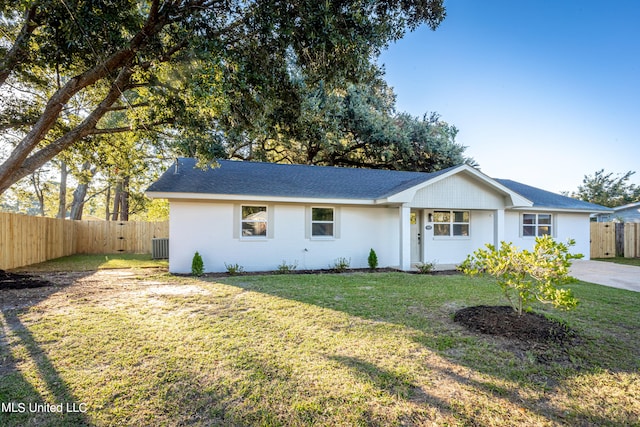 ranch-style home with a front lawn