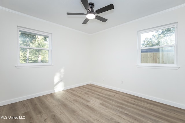 unfurnished room with ornamental molding, light hardwood / wood-style flooring, and ceiling fan