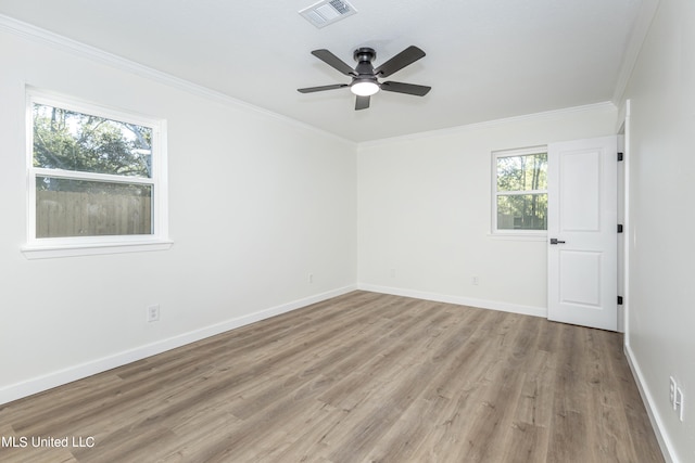 empty room with light hardwood / wood-style flooring, ceiling fan, and a wealth of natural light