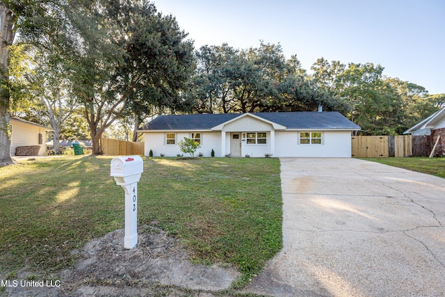 ranch-style home featuring a front yard