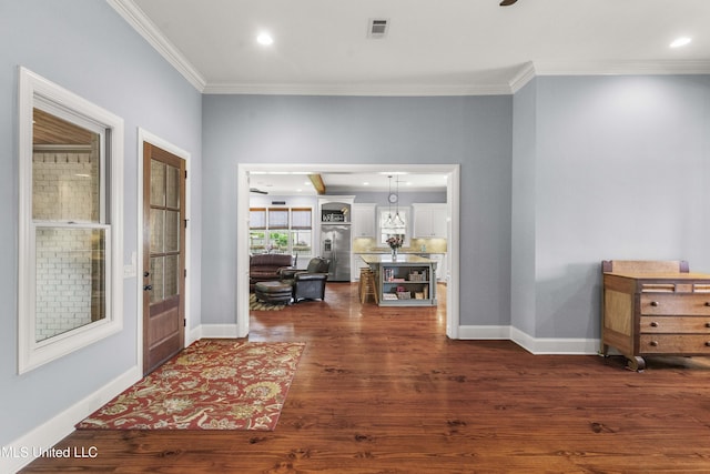foyer with dark wood-style flooring, visible vents, baseboards, ornamental molding, and recessed lighting