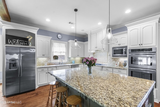 kitchen featuring white cabinetry, appliances with stainless steel finishes, a sink, and dark wood finished floors