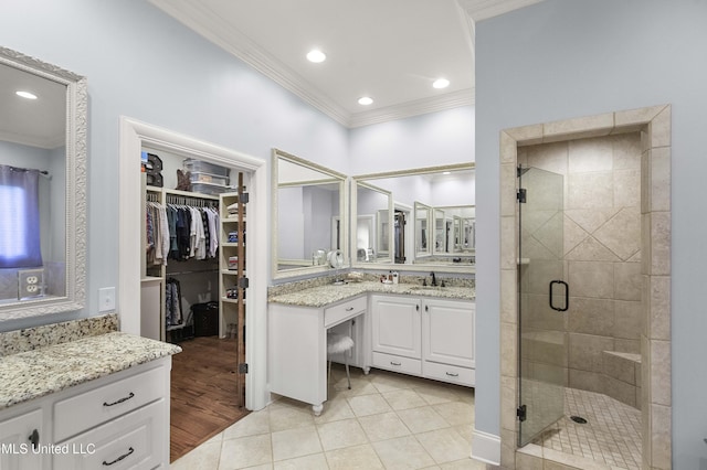 full bath featuring crown molding, recessed lighting, vanity, and a stall shower