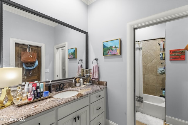 bathroom with shower / bath combo with shower curtain, baseboards, ornamental molding, and vanity