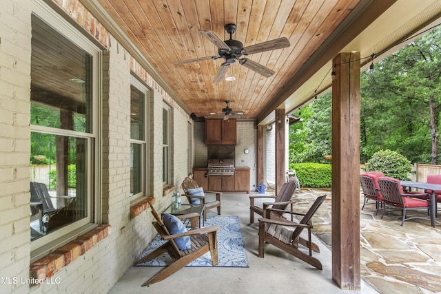 view of patio with ceiling fan, a grill, and area for grilling