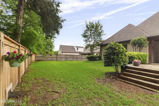 view of yard featuring a fenced backyard