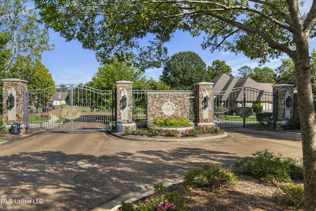 view of gate featuring fence