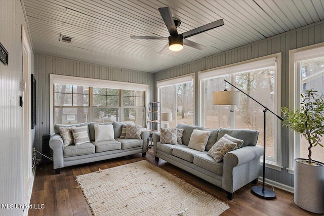 sunroom / solarium featuring ceiling fan