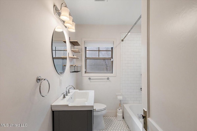 full bathroom featuring tile patterned flooring, vanity, toilet, and tiled shower / bath combo