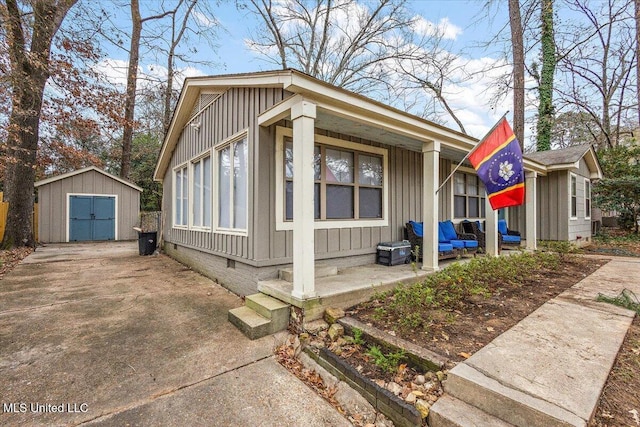 view of side of property with a shed