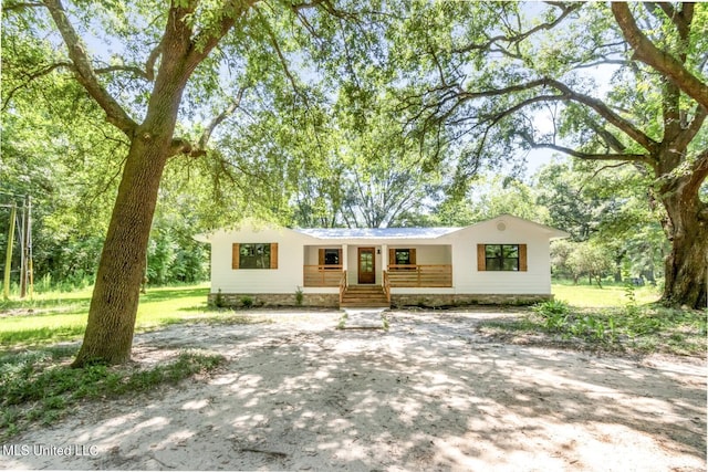 single story home featuring covered porch