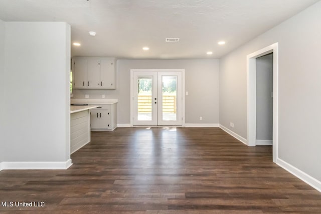 interior space featuring french doors, dark wood-type flooring, recessed lighting, and baseboards