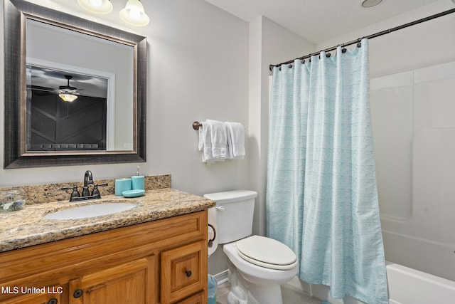 full bathroom featuring toilet, vanity, ceiling fan, and shower / tub combo with curtain