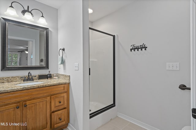 bathroom with vanity, an enclosed shower, tile patterned flooring, and ceiling fan