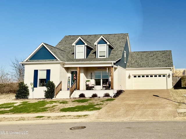 new england style home featuring an attached garage, brick siding, driveway, and a shingled roof