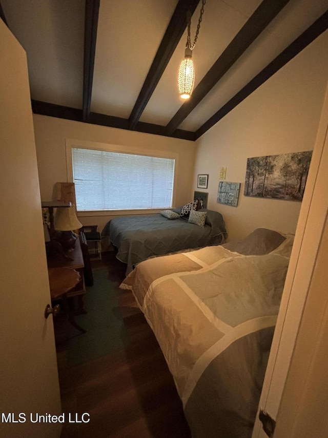 bedroom featuring lofted ceiling with beams and wood finished floors