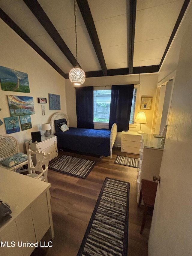 bedroom featuring wood finished floors and vaulted ceiling with beams