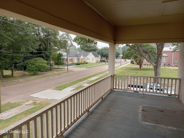 107 E Percy St, Indianola, MS 38751 - wooden deck with a porch and a residential view
