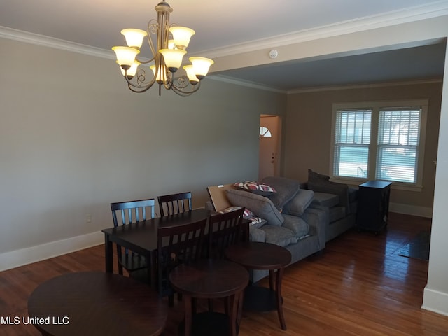 107 E Percy St, Indianola, MS 38751 - dining space featuring a chandelier, crown molding, wood finished floors, and baseboards