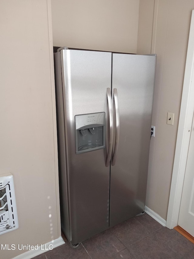 107 E Percy St, Indianola, MS 38751 - kitchen view of stainless steel refrigerator with ice dispenser and baseboards