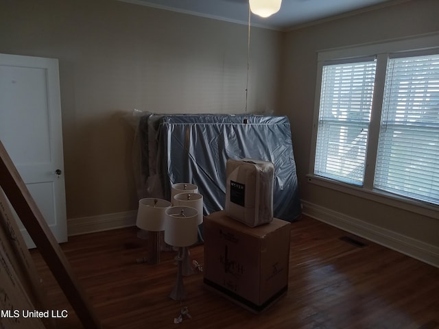 107 E Percy St, Indianola, MS 38751 - bedroom with baseboards, wood finished floors, and crown molding