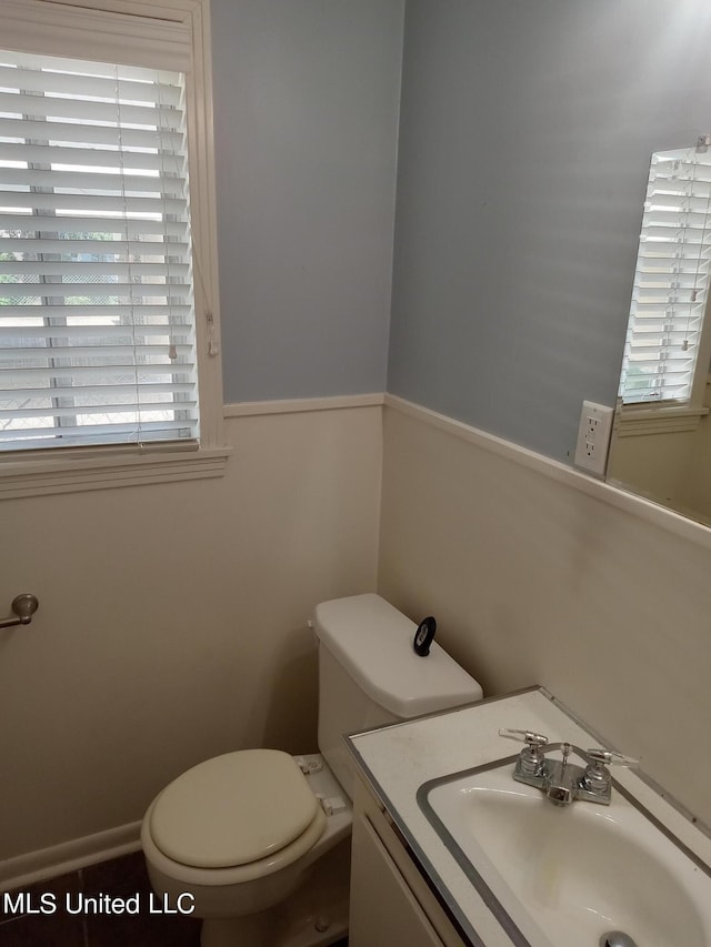 107 E Percy St, Indianola, MS 38751 - half bathroom featuring toilet, healthy amount of natural light, and vanity