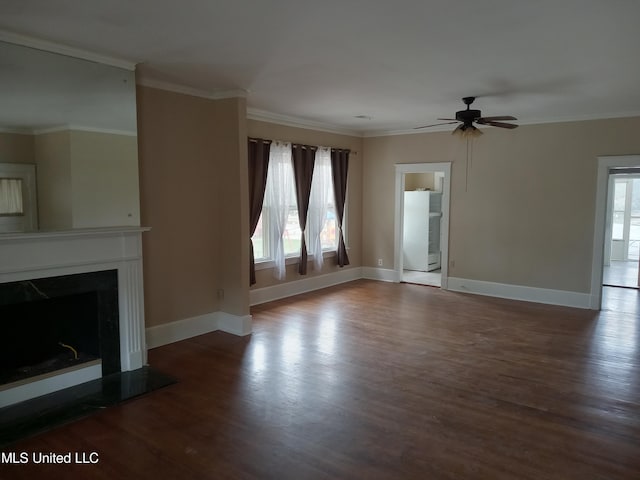 107 E Percy St, Indianola, MS 38751 - unfurnished living room featuring wood finished floors, a ceiling fan, baseboards, a premium fireplace, and ornamental molding