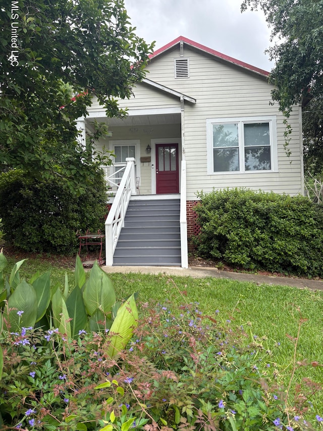 bungalow-style home with stairway