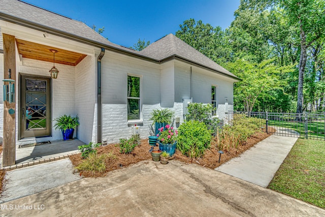 102 Silverleaf Dr, Madison, MS 39110 - entrance to property with brick siding, fence, and a shingled roof