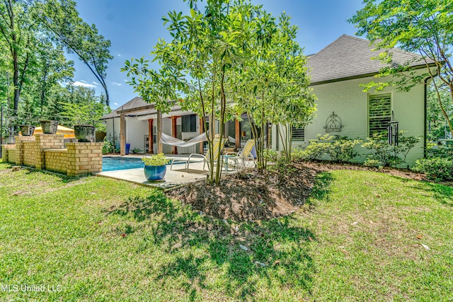 102 Silverleaf Dr, Madison, MS 39110 - rear view of property with roof with shingles, a lawn, a patio area, and an outdoor pool