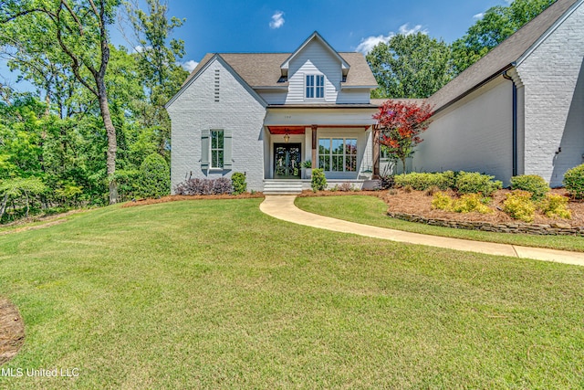 102 Silverleaf Dr, Madison, MS 39110 - view of front of home featuring brick siding, a front yard, and a shingled roof