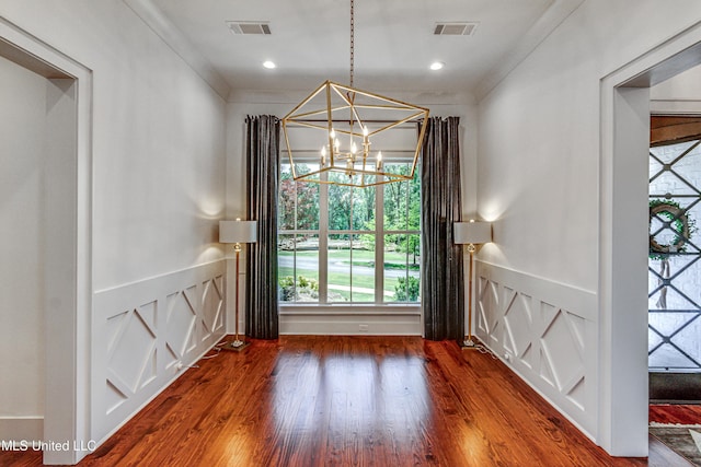 102 Silverleaf Dr, Madison, MS 39110 - unfurnished dining area featuring a chandelier, plenty of natural light, and wood finished floors