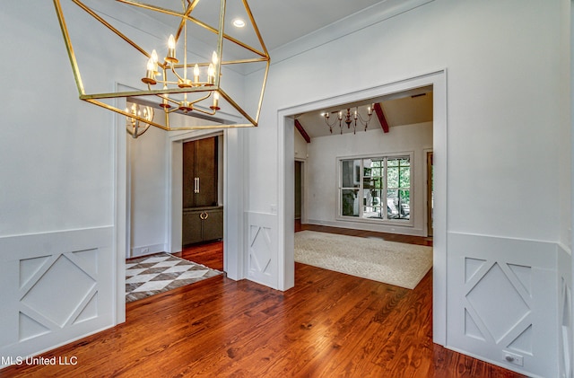 102 Silverleaf Dr, Madison, MS 39110 - unfurnished dining area with a chandelier, lofted ceiling, and dark wood-type flooring