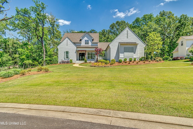 102 Silverleaf Dr, Madison, MS 39110 - view of front of home featuring a front yard, roof with shingles, and brick siding