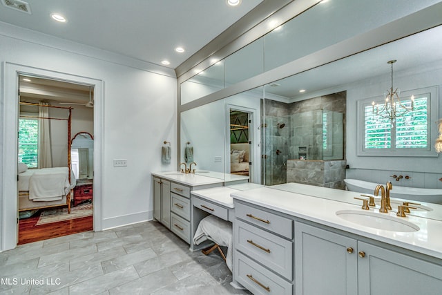 102 Silverleaf Dr, Madison, MS 39110 - ensuite bathroom featuring tiled shower, vanity, a chandelier, recessed lighting, and baseboards