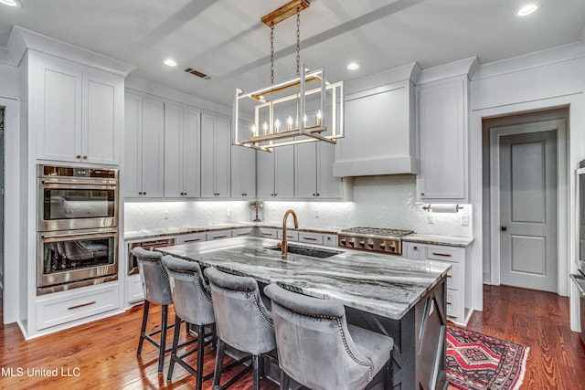 102 Silverleaf Dr, Madison, MS 39110 - kitchen featuring a sink, stainless steel appliances, a chandelier, tasteful backsplash, and recessed lighting